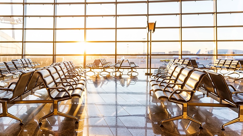Empty airport departure lounge (Mikhail Starodubov/Shutterstock.com)