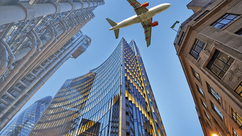 Plane over London (pbombaert/Shutterstock.com)