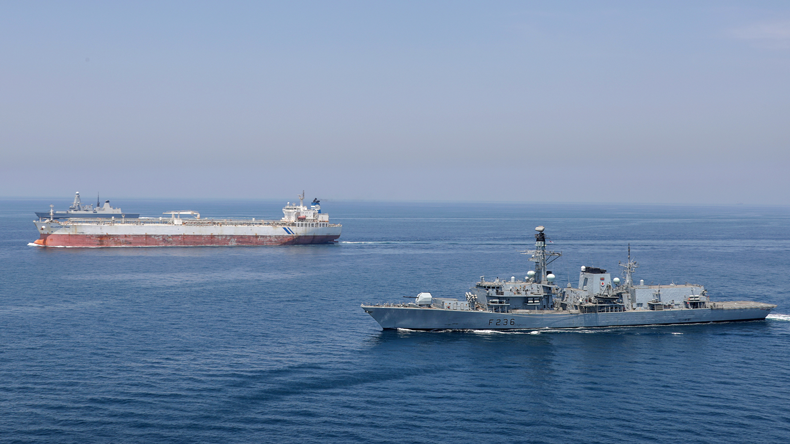 Royal Navy warship escorts tanker